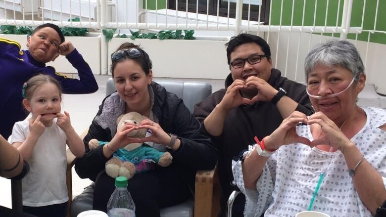 Millie Kuliktana, far right, with supporters at the hospital in Edmonton.